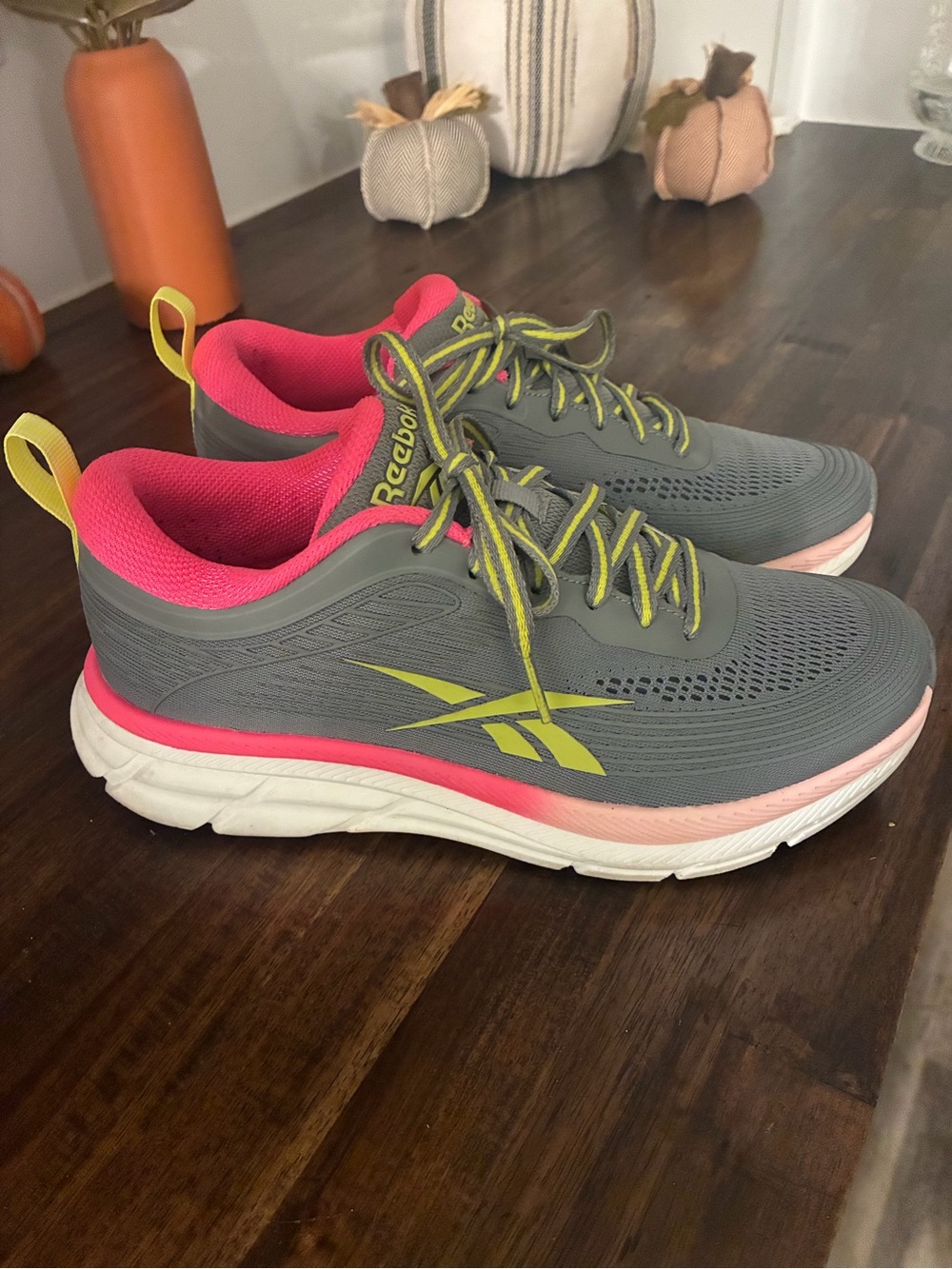 Reebok Gray Athletic Sneakers with Pink Lining and Yellow Accents